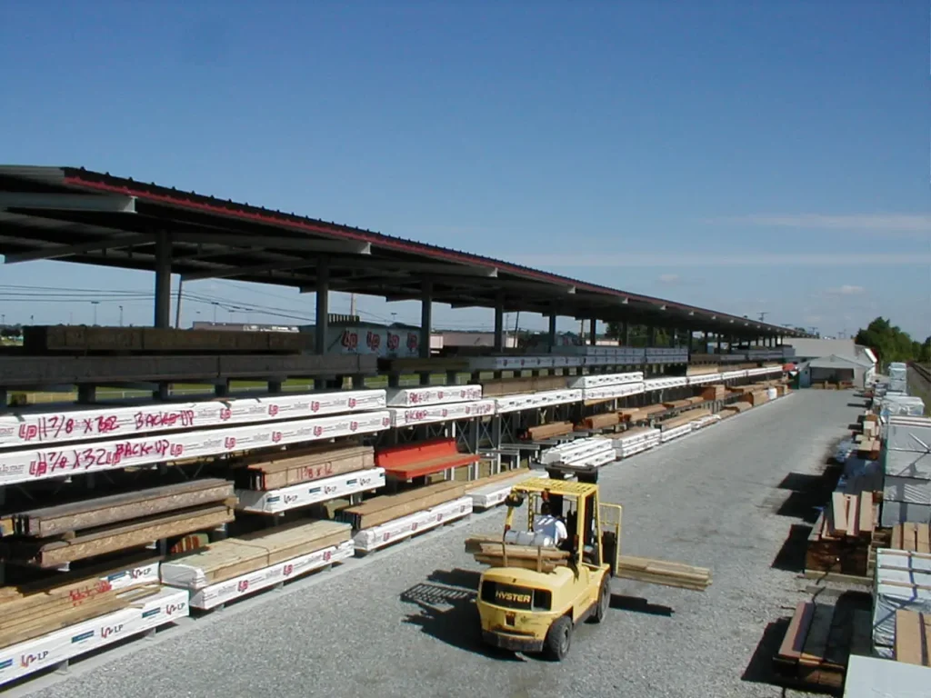 Forklift transporting materials using Dexco Outdoor Shed Racking System