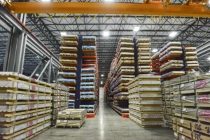 Dexco cantilever racks storing heavy steel plate organized by size at a metals distribution facility