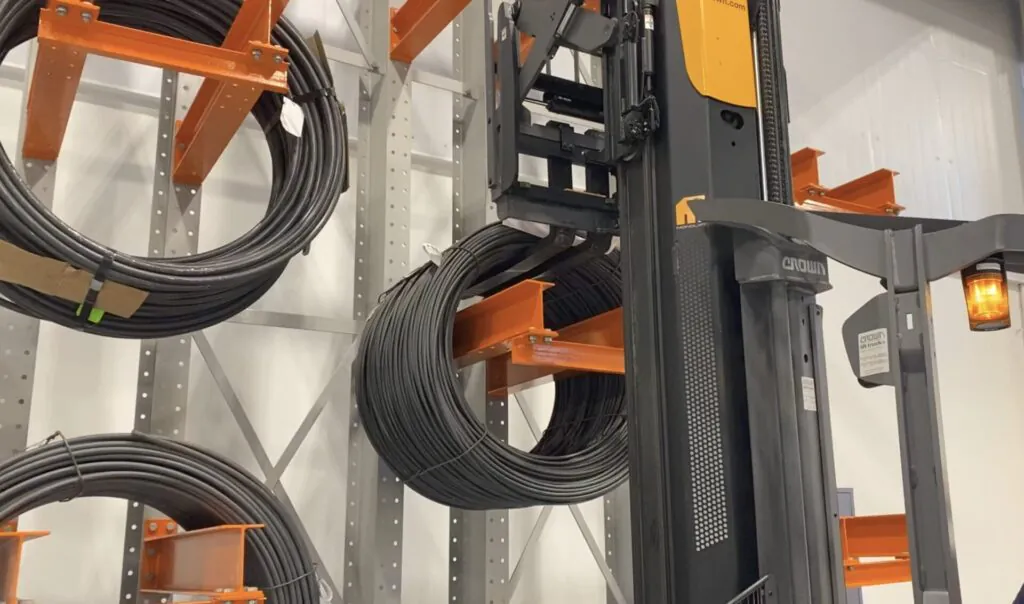 Dexco cantilever rack storing industrial cable spools