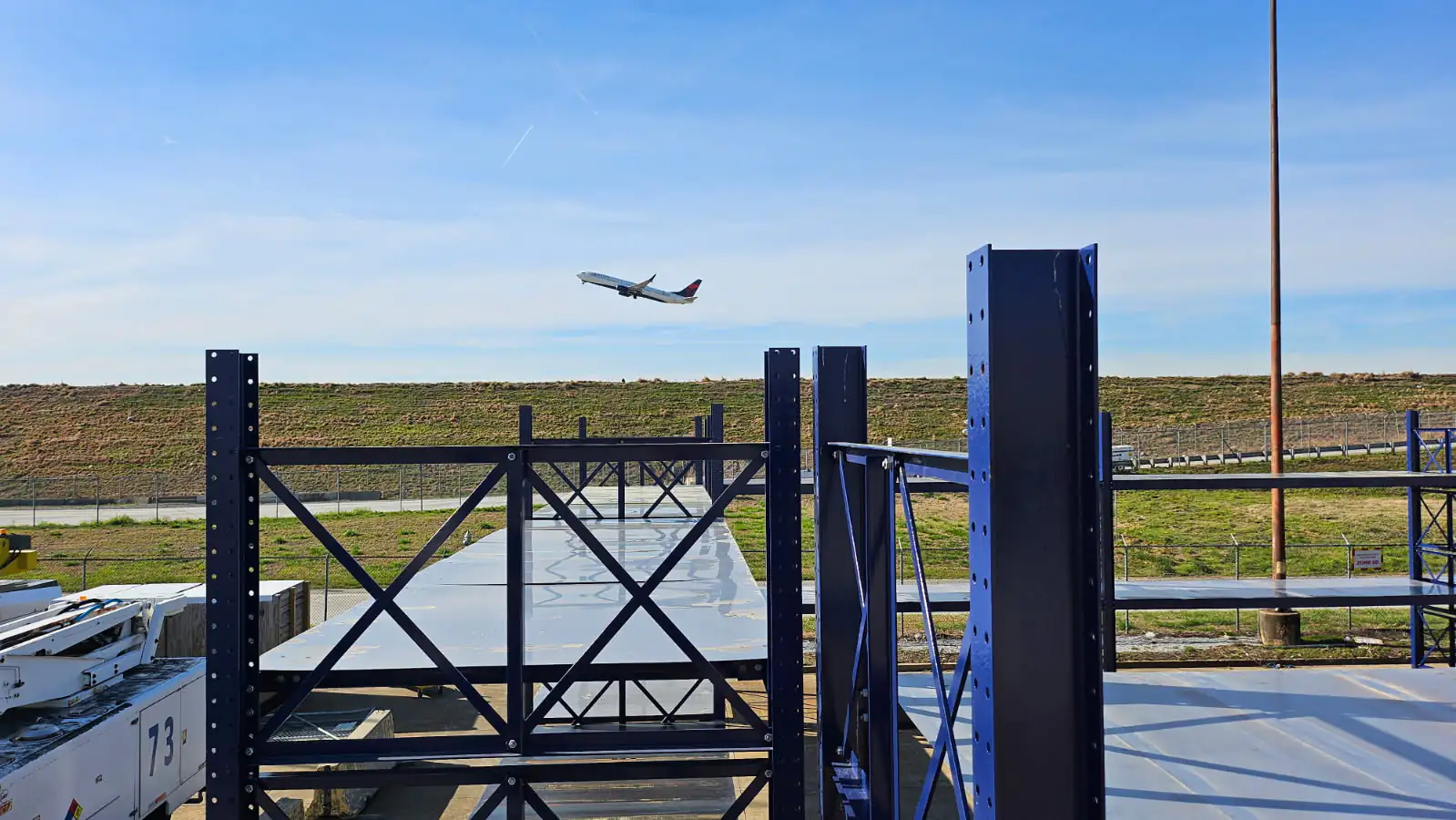 Dexco widespan racks with decking installed outdoors at an airport for maintenance components